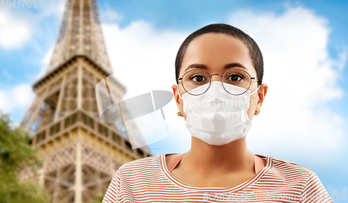 Image of young african american woman in protective mask