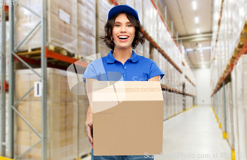 Image of happy delivery girl with parcel box at warehouse