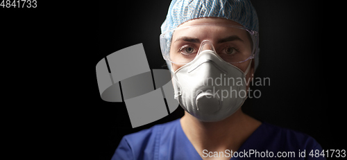 Image of doctor in goggles and protective face mask