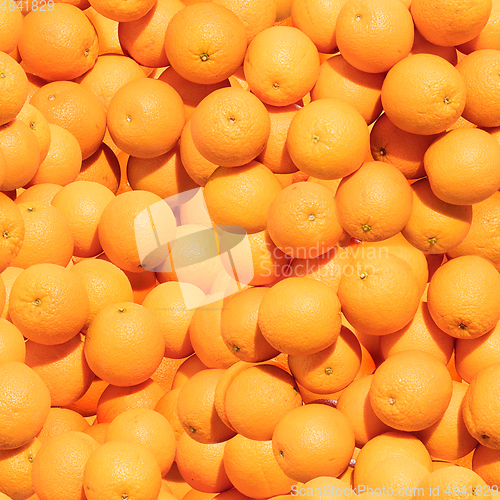 Image of Pattern made from bunch of oranges. Top view, flat design. Healthy food.