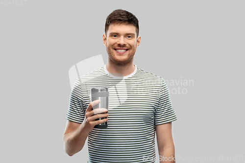 Image of man with thermo cup or tumbler for hot drinks