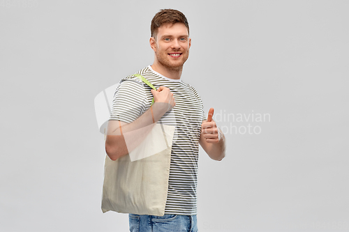 Image of man with reusable canvas bag for food shopping