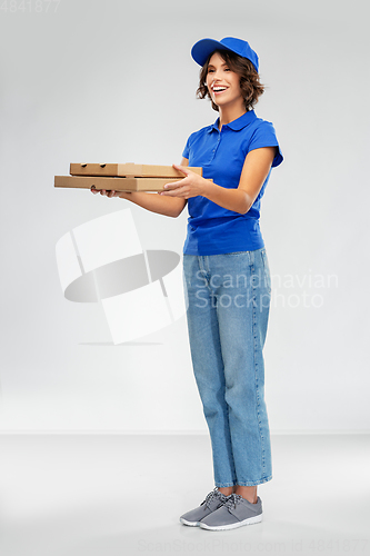 Image of happy smiling delivery woman with pizza boxes