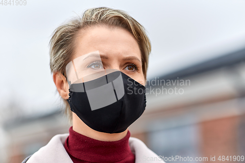 Image of woman wearing protective reusable barrier mask