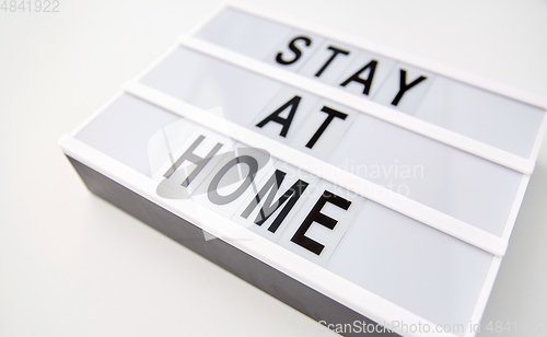 Image of lightbox with stay at home caution words