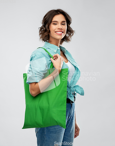 Image of woman with reusable canvas bag for food shopping