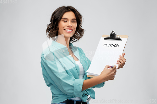 Image of smiling woman with petition on clipboard and pen