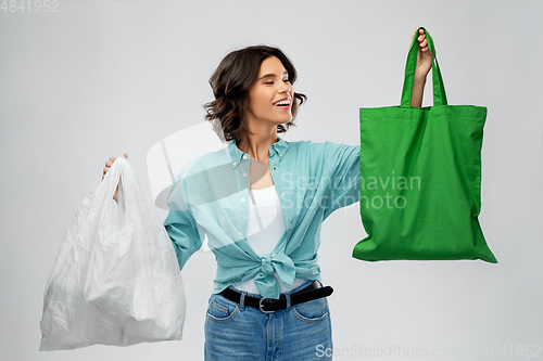 Image of woman with plastic and reusable shopping bag