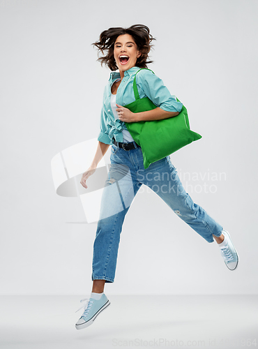 Image of woman with reusable canvas bag for food shopping