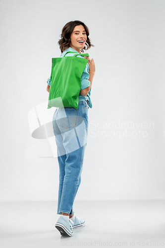 Image of woman with reusable canvas bag for food shopping