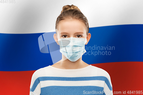 Image of teenage girl in medical mask over flag of russia