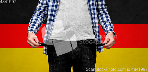 Image of close up of man showing empty pockets