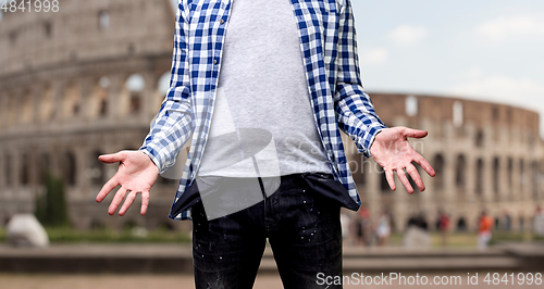 Image of close up of man showing empty pockets in italy