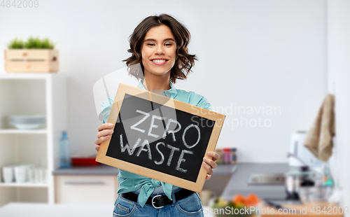 Image of happy woman with chalkboard with zero waste words