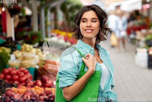 Image of woman with reusable canvas bag for food shopping