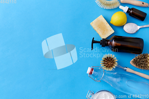 Image of lemons, soap, washing soda, vinegar and brushes