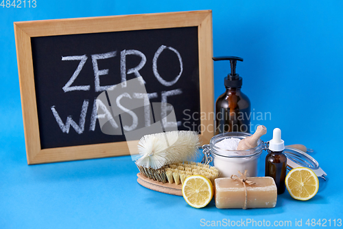 Image of zero waste words on chalkboard and cleaning stuff