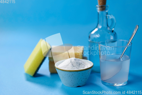 Image of washing soda, sponge, soap, vinegar and glass