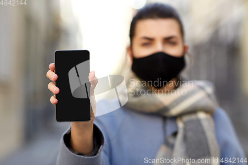 Image of woman wearing protective reusable barrier mask