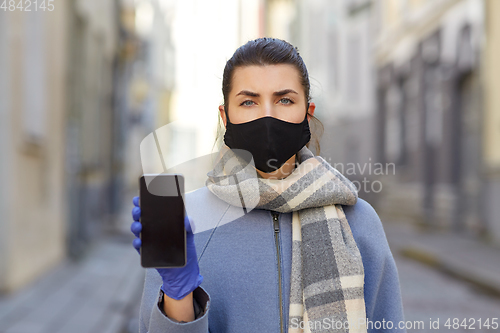 Image of woman wearing protective reusable barrier mask