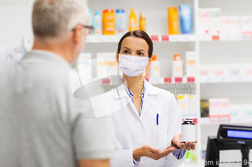 Image of apothecary in mask showing drug to man at pharmacy