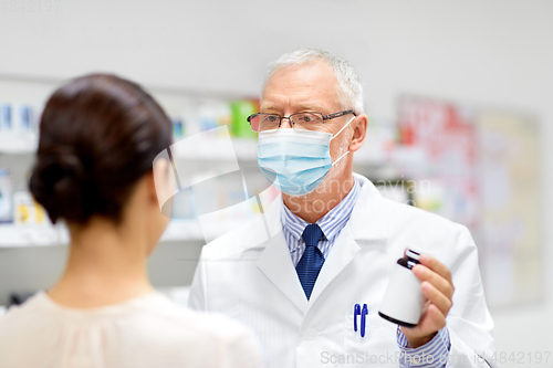 Image of apothecary in mask showing drug to customer