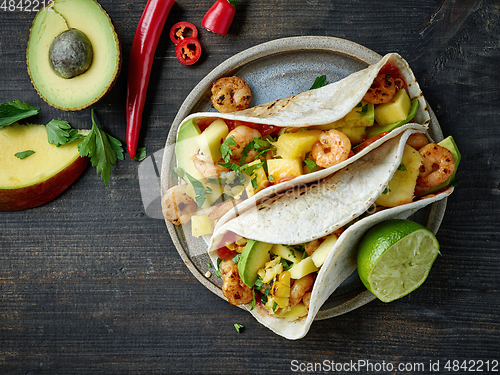 Image of Mexican food Tacos isolated on wood background