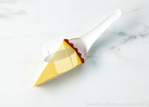 Image of slice of fresh vegan mango cake