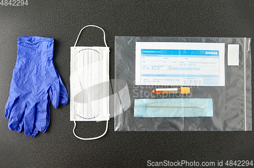 Image of test tube, medical report, gloves and mask