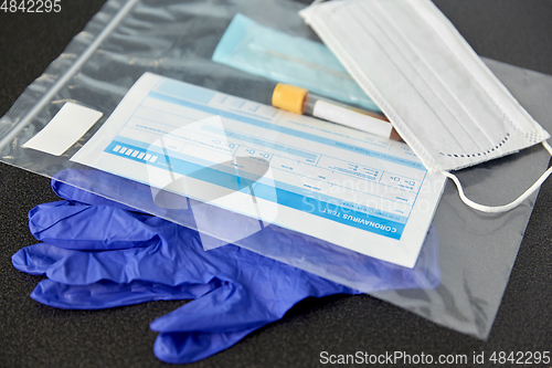 Image of test tube, medical report, gloves and mask