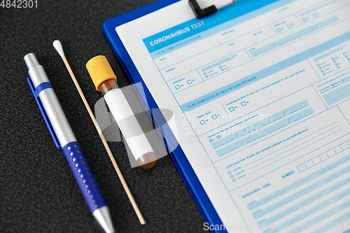 Image of medical report, test tube, cotton swab and pen