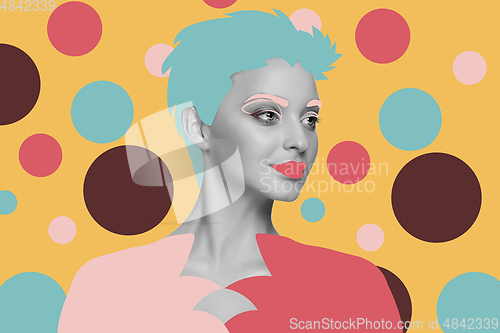 Image of Portrait of a beautiful young woman with bright colorful painted design