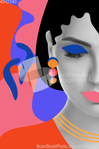 Image of Portrait of a beautiful young woman with bright colorful painted design