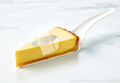 Image of slice of fresh vegan mango cake