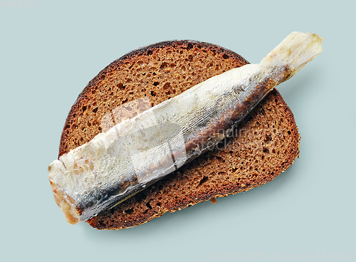 Image of canned sardine on bread slice