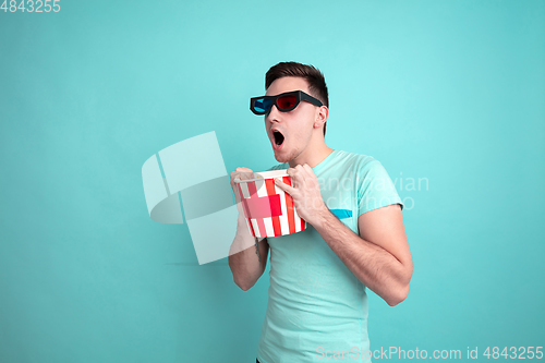 Image of Caucasian young man\'s portrait on blue studio background