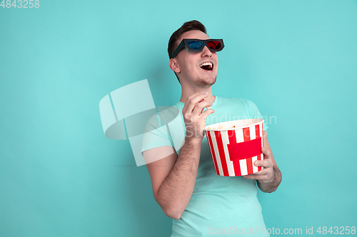 Image of Caucasian young man\'s portrait on blue studio background