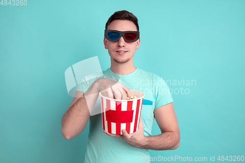 Image of Caucasian young man\'s portrait on blue studio background