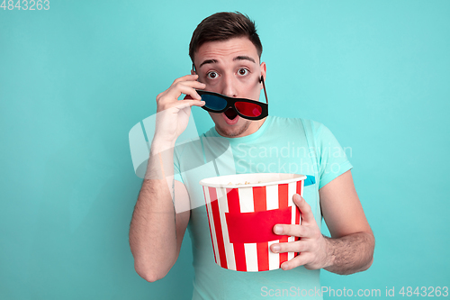 Image of Caucasian young man\'s portrait on blue studio background