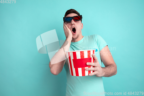 Image of Caucasian young man\'s portrait on blue studio background