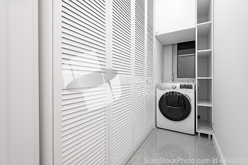 Image of White utility room with wardobe in new apartment