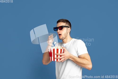 Image of Caucasian young man\'s portrait on blue studio background