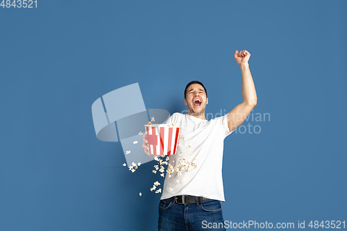 Image of Caucasian young man\'s portrait on blue studio background