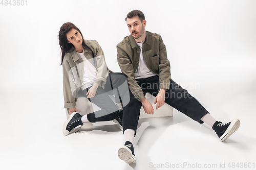 Image of Trendy fashionable couple isolated on white studio background