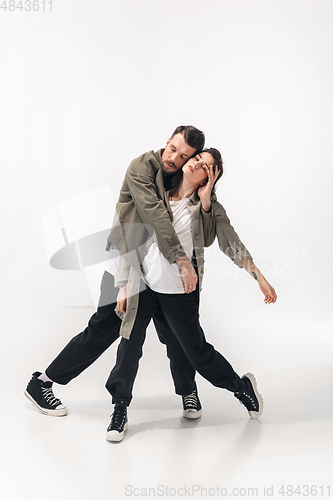 Image of Trendy fashionable couple isolated on white studio background