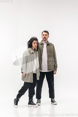 Image of Trendy fashionable couple isolated on white studio background