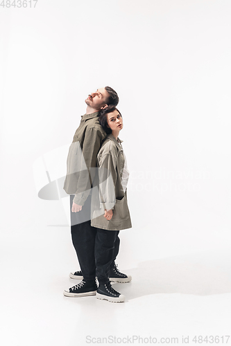 Image of Trendy fashionable couple isolated on white studio background