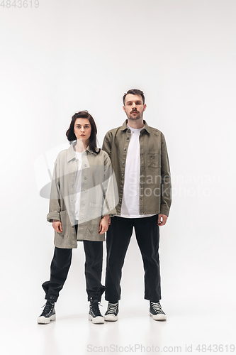 Image of Trendy fashionable couple isolated on white studio background