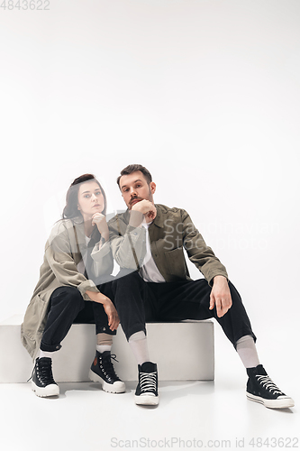 Image of Trendy fashionable couple isolated on white studio background