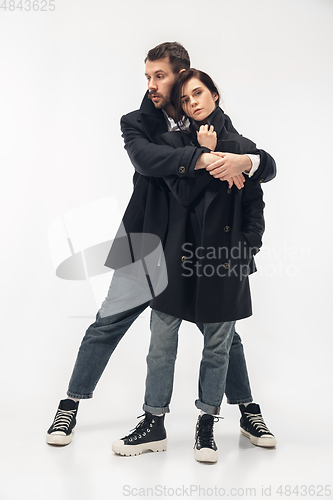 Image of Trendy fashionable couple isolated on white studio background